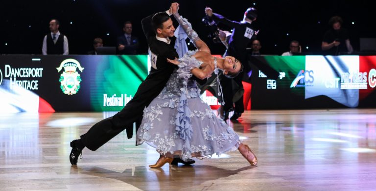 Christopher and his partner Holly dancing at a competition